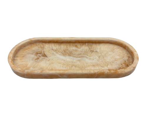 oval shallow resin tray with marbled beige and white patterns on a white background