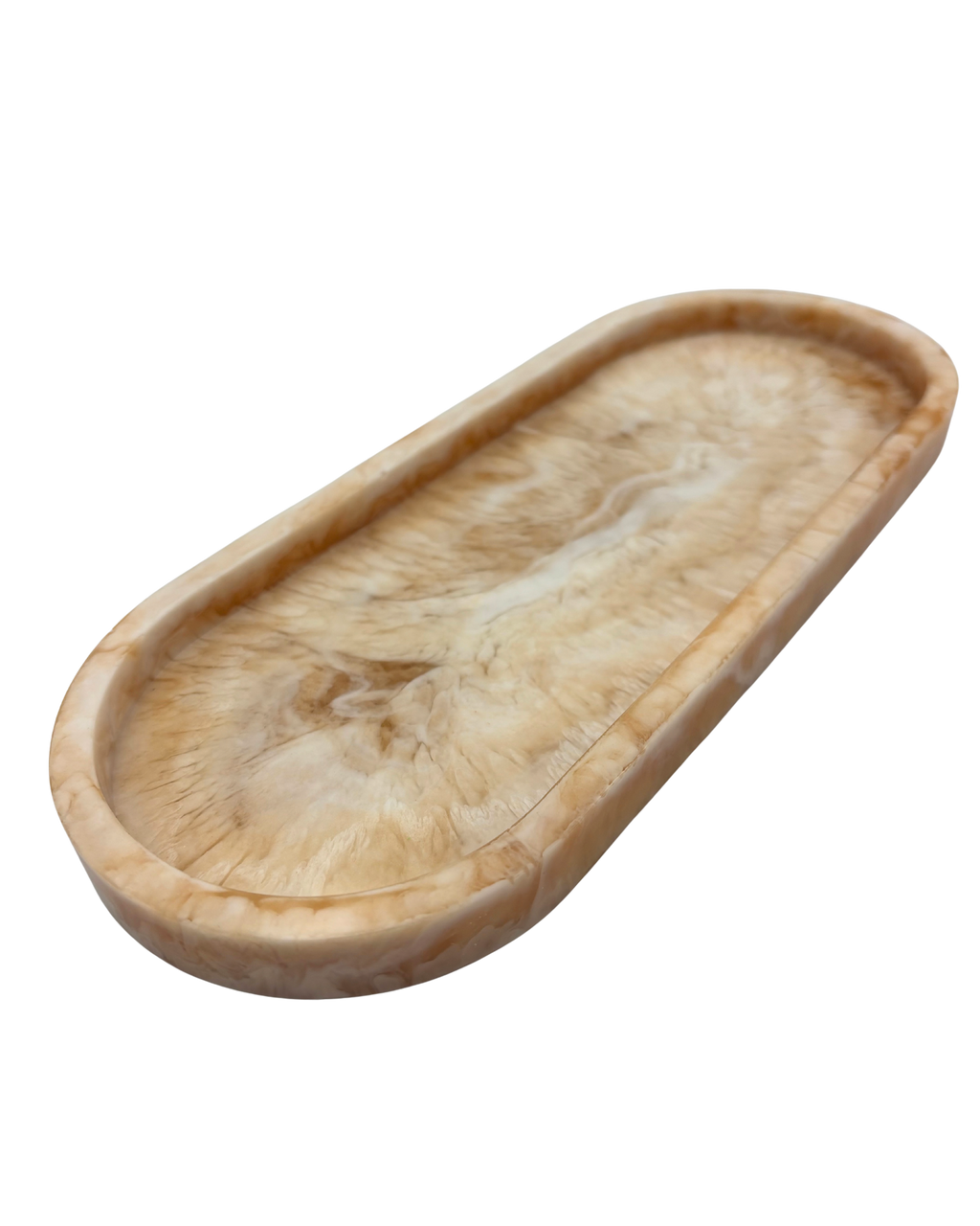 oval shallow resin tray with marbled beige and white patterns on a white background
