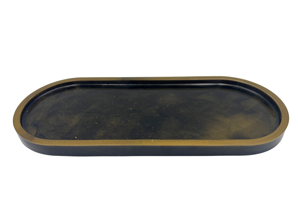 An oval-shaped tray with a dark black interior and a metallic bronze-gold rim, shown against a plain white background.