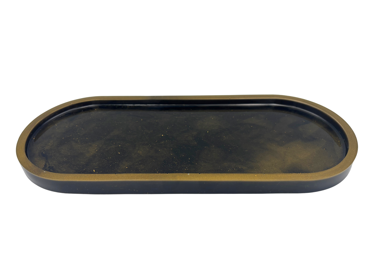 An oval-shaped tray with a dark black interior and a metallic bronze-gold rim, shown against a plain white background.