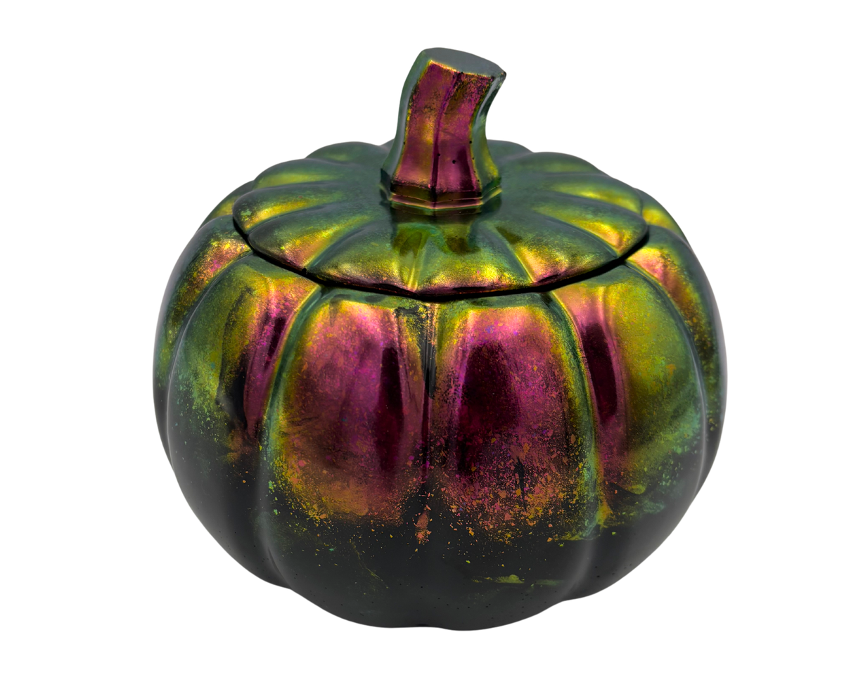 black resin pumpkin dish with lid, with iridescent finishes, on a white background