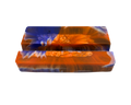 A mobile phone stand, featuring a marbled pattern of vibrant orange, deep blue, and white swirls with a textured bubbly finish.