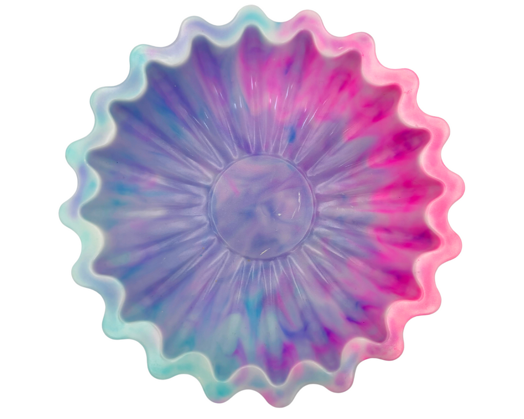 blue and pink resin bowl with scalloped edges