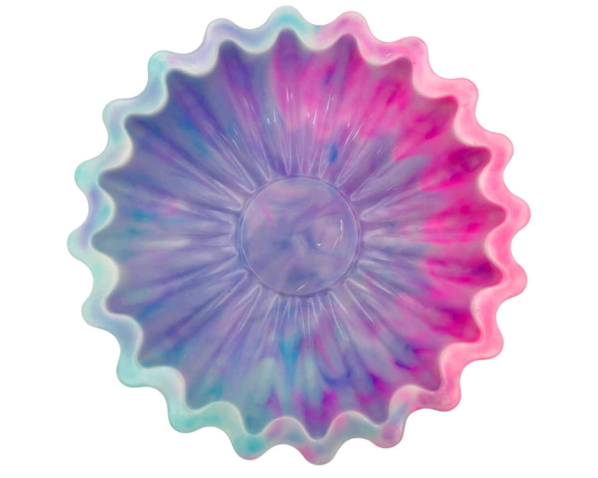 blue and pink resin bowl with scalloped edges