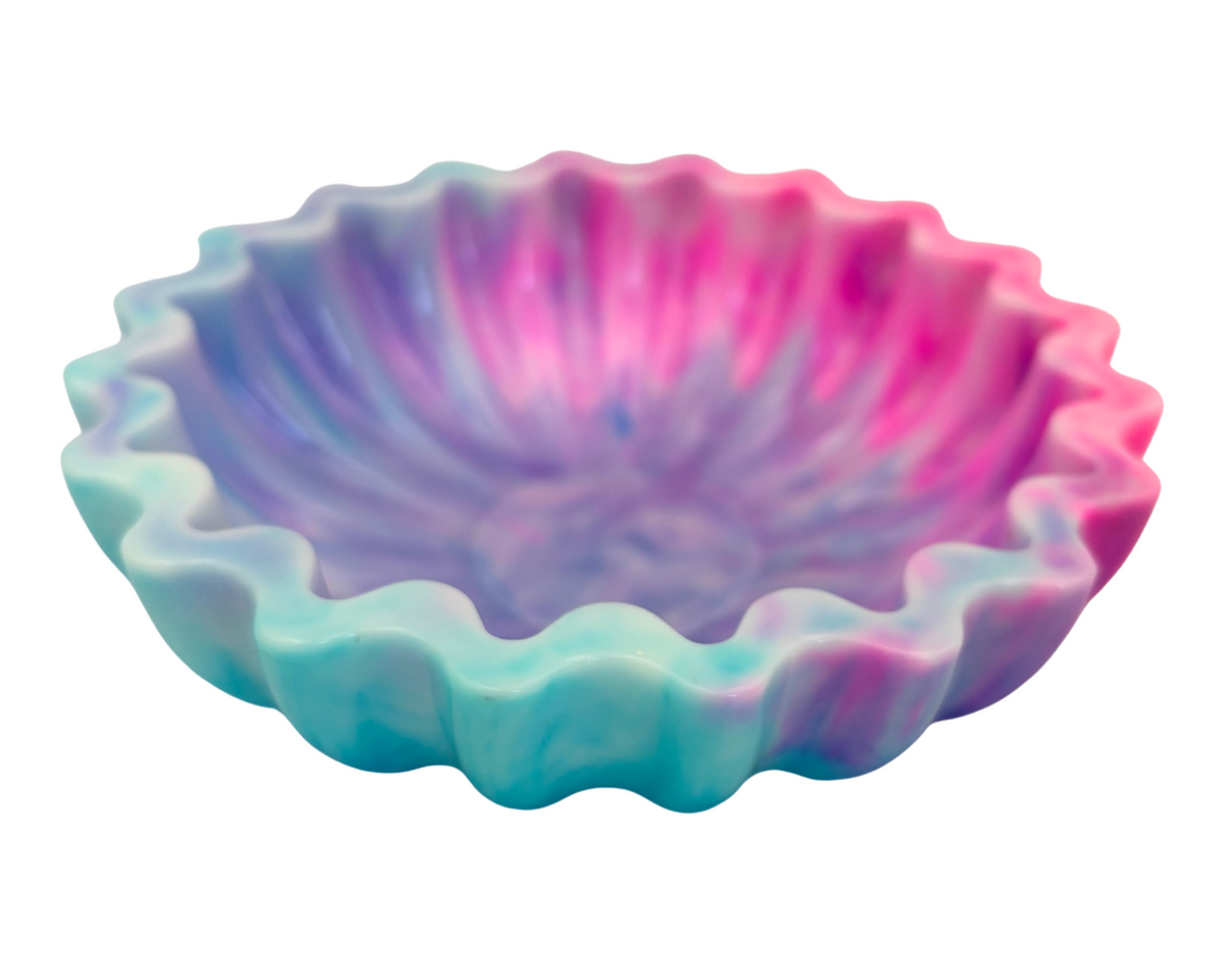 blue and pink resin bowl with scalloped edges