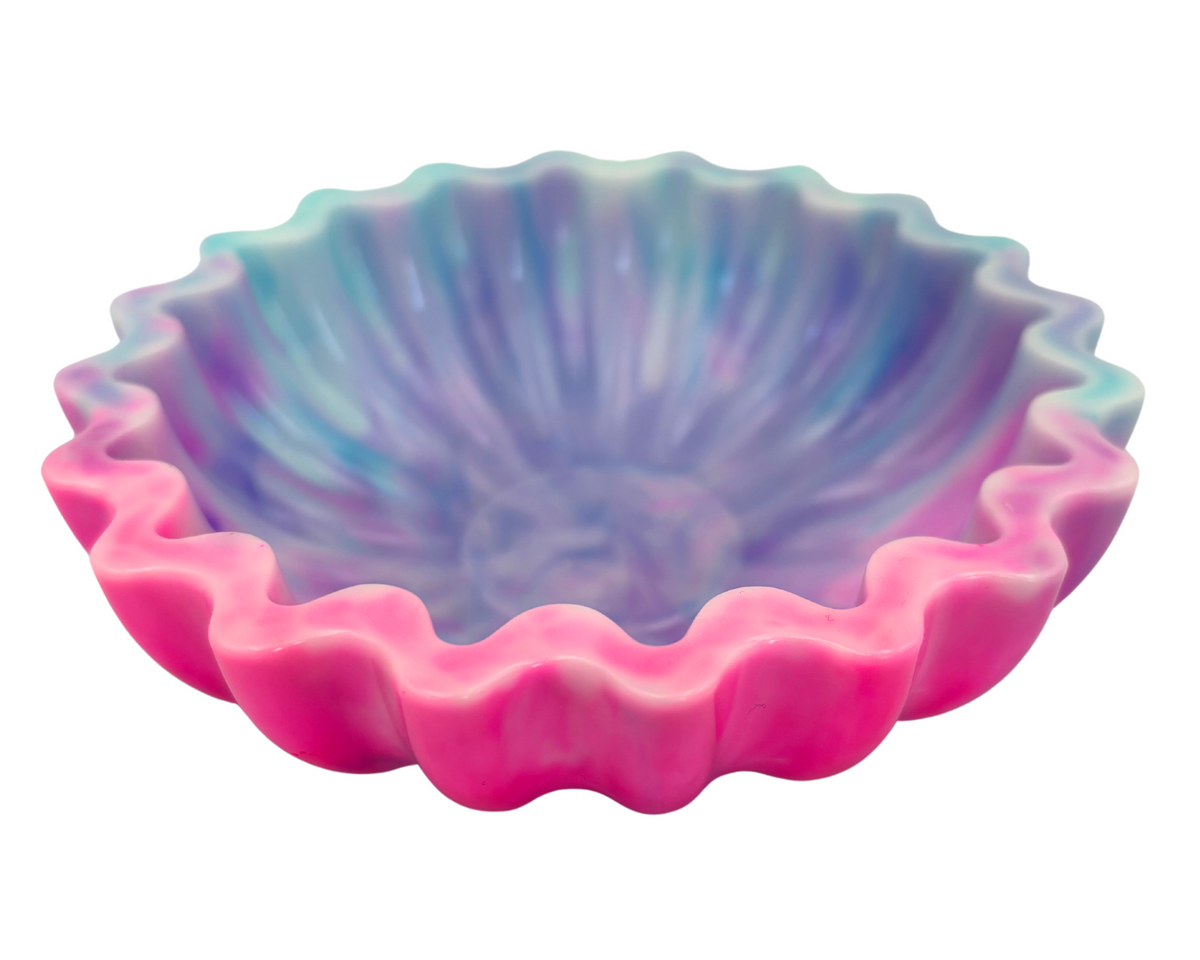 blue and pink resin bowl with scalloped edges