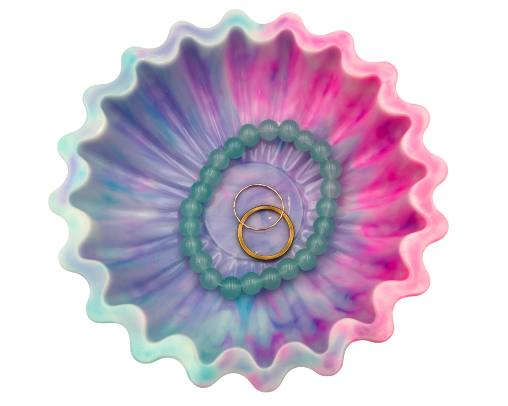 blue and pink resin bowl with scalloped edges