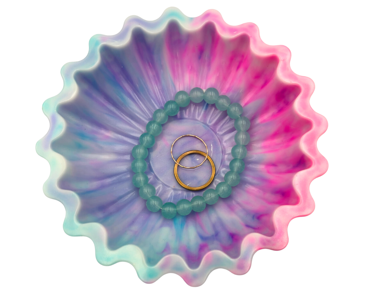 blue and pink resin bowl with scalloped edges