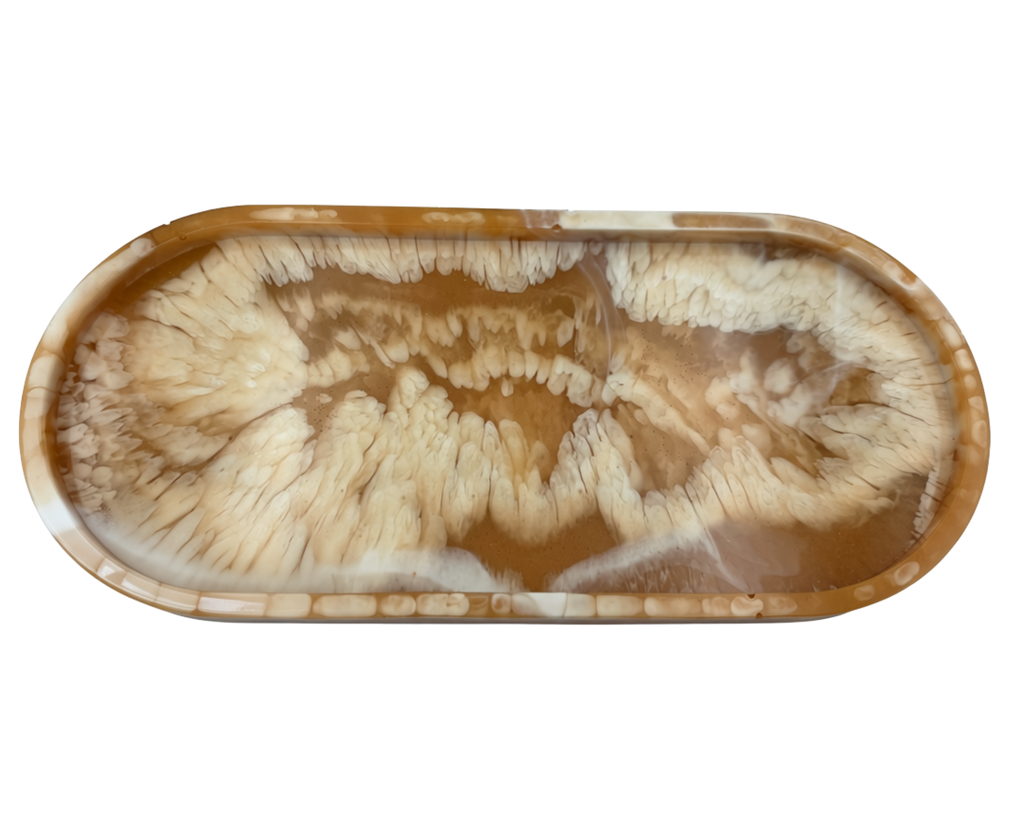An oval resin tray with a swirling agate-like pattern in shades of brown, tan, and cream, isolated on a white background.