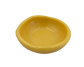 A small, shallow yellow resin bowl with a slightly irregular, organic shape, shown against a plain white background.
