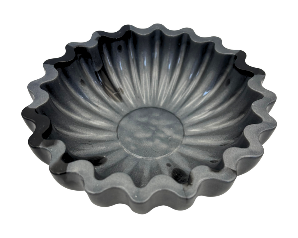 Gray and black resin bowl with scalloped edges