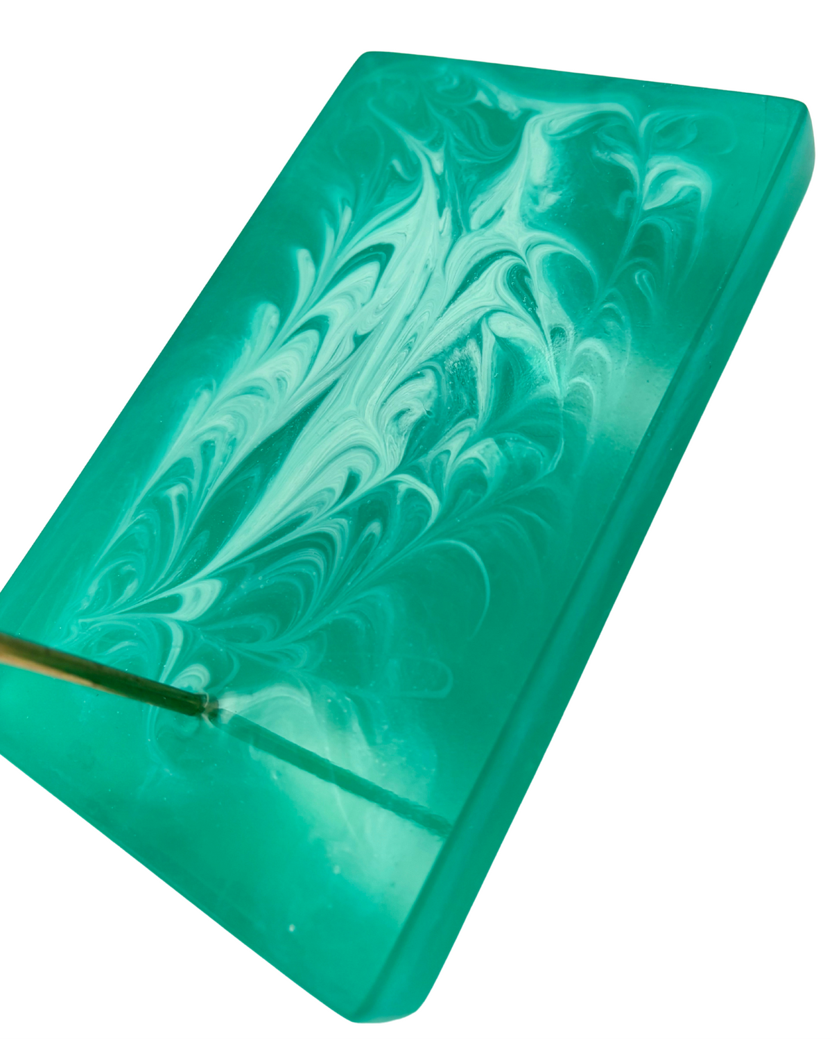 Close up of green resin base of glasses holder