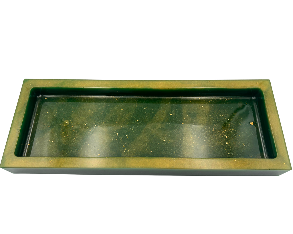 A rectangular resin tray with a thick gold-toned border and a dark green base with gold flecks shown on a plain white background.