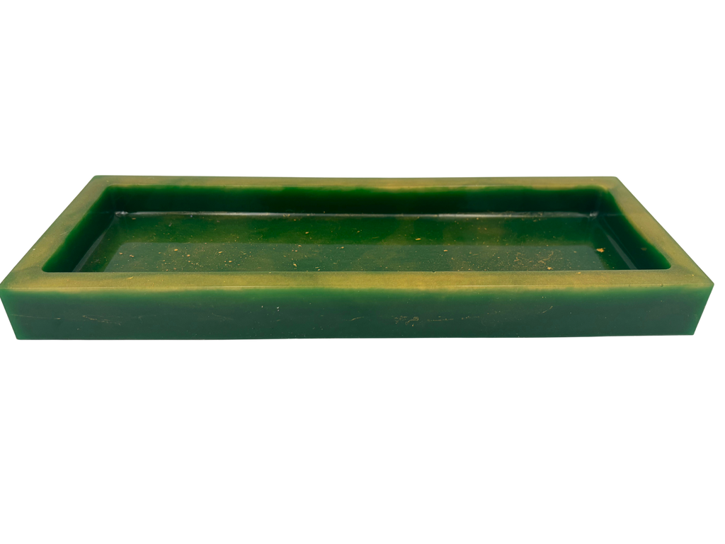 A rectangular resin tray with a thick gold-toned border and a dark green base with gold flecks shown on a plain white background.