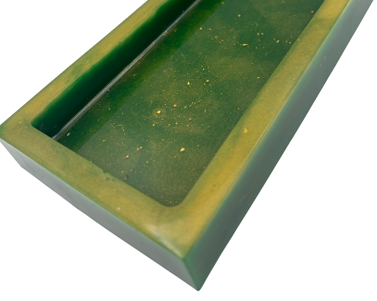 A rectangular resin tray with a thick gold-toned border and a dark green base with gold flecks shown on a plain white background.
