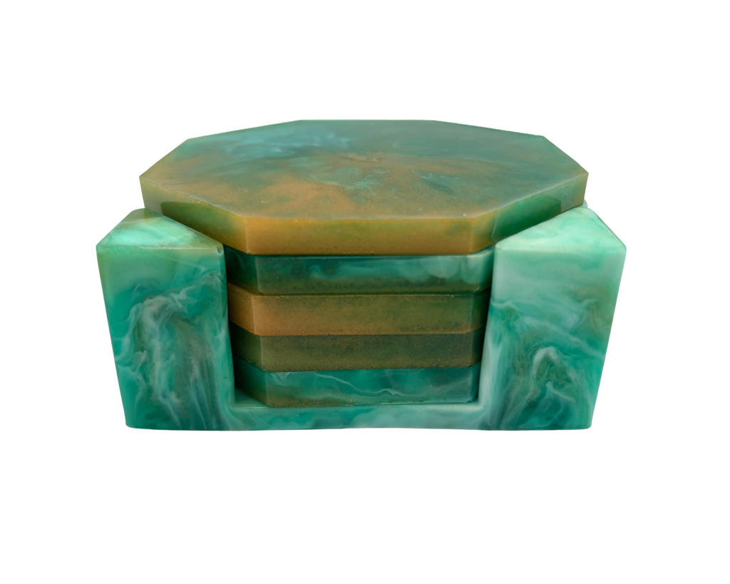 A decorative octagonal coasters with a matching stand, featuring a marbled green and gold top and a base made of swirled teal and white resin, shown on a plain white background.