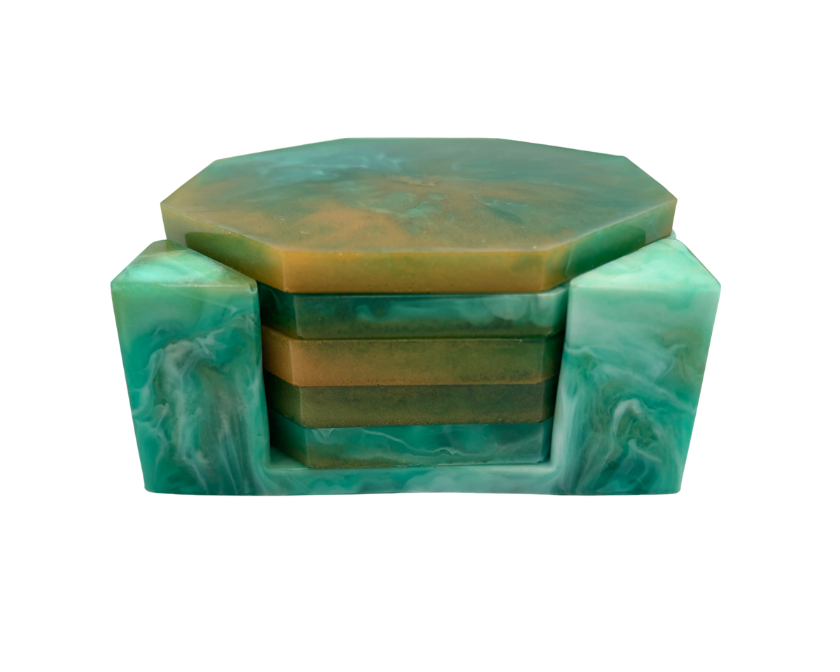 A decorative octagonal coasters with a matching stand, featuring a marbled green and gold top and a base made of swirled teal and white resin, shown on a plain white background.