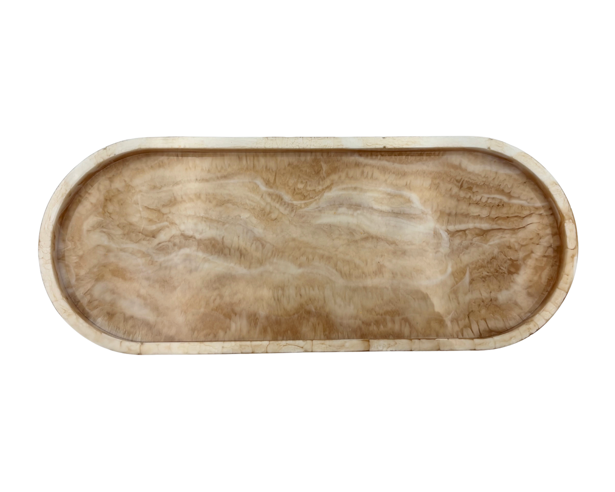 An oval resin tray with a marbled beige pattern , shown from a top-down perspective on a white background