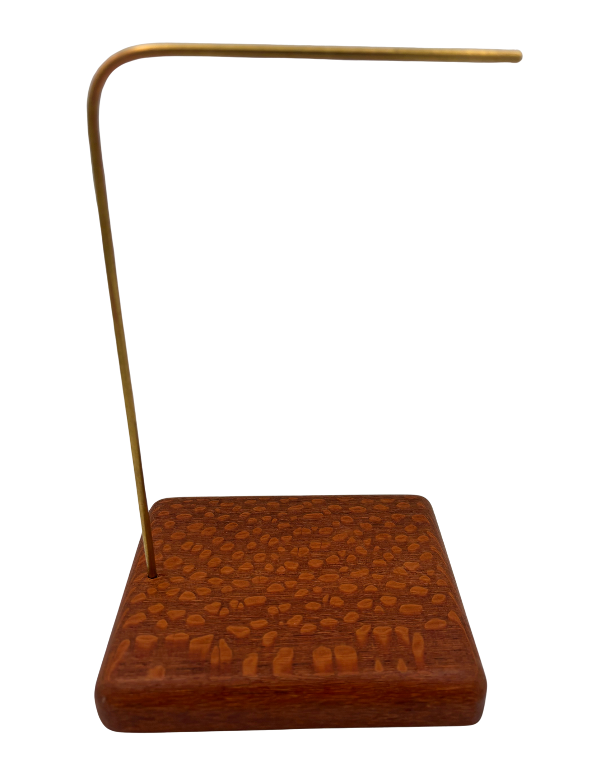 A brass and wood jewelry display stand featuring a textured reddish-brown wooden base and a curved brass rod, shown against a plain white background.