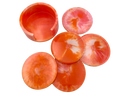Set of resin coasters with holder; pink, orange, and white swirl pattern on a white background