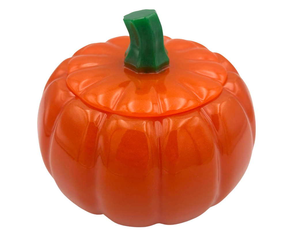 An orange pumpkin-shaped container with a matching lid and a green stem, shown on a plain white background.
