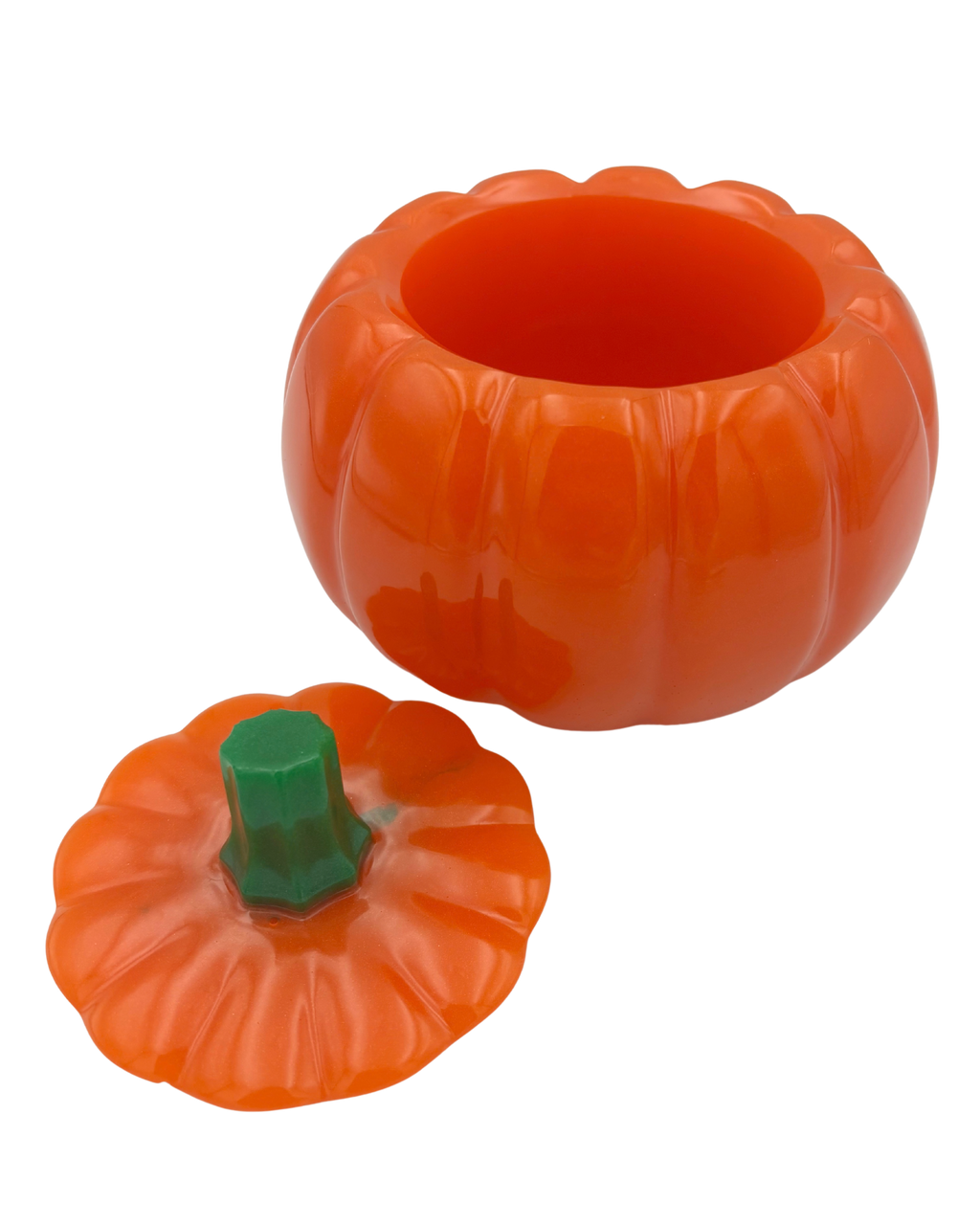An orange pumpkin-shaped container with a matching lid and a green stem, shown on a plain white background.