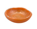 An orange resin ring dish, photographed from a top-down angle on a solid white background.