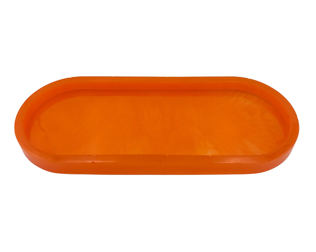 An orange translucent resin tray with a rounded rectangular shape and raised rim, shown against a plain white background.