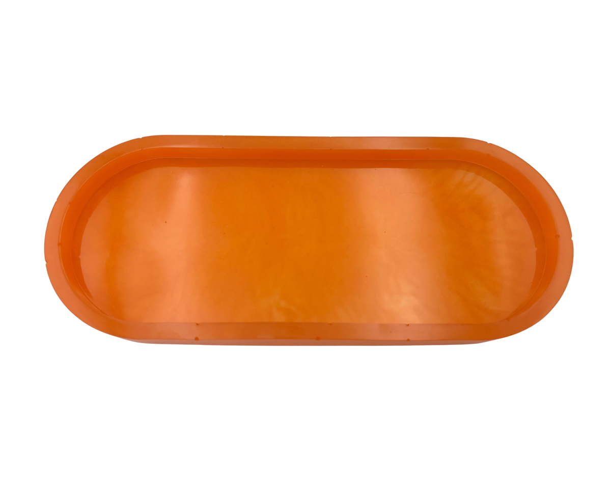An orange translucent resin tray with a rounded rectangular shape and raised rim, shown against a plain white background.