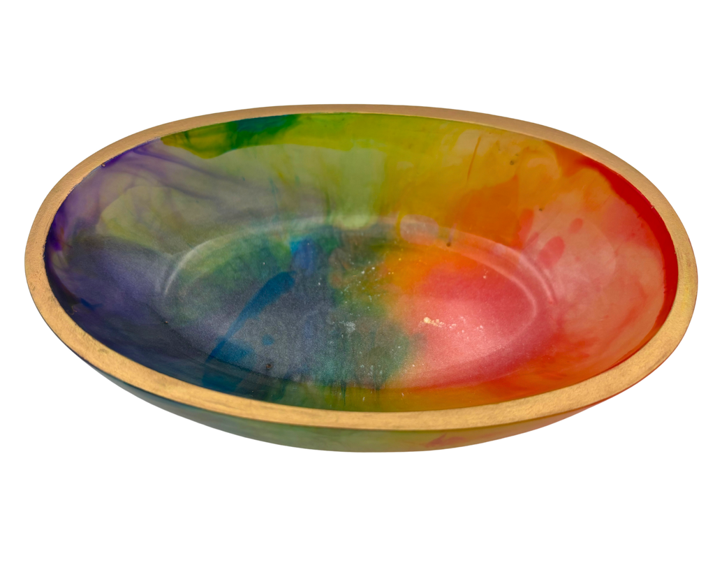 An oval ceramic bowl with a colorful tie-dye pattern inside and a gold rim, shown on a plain white background.