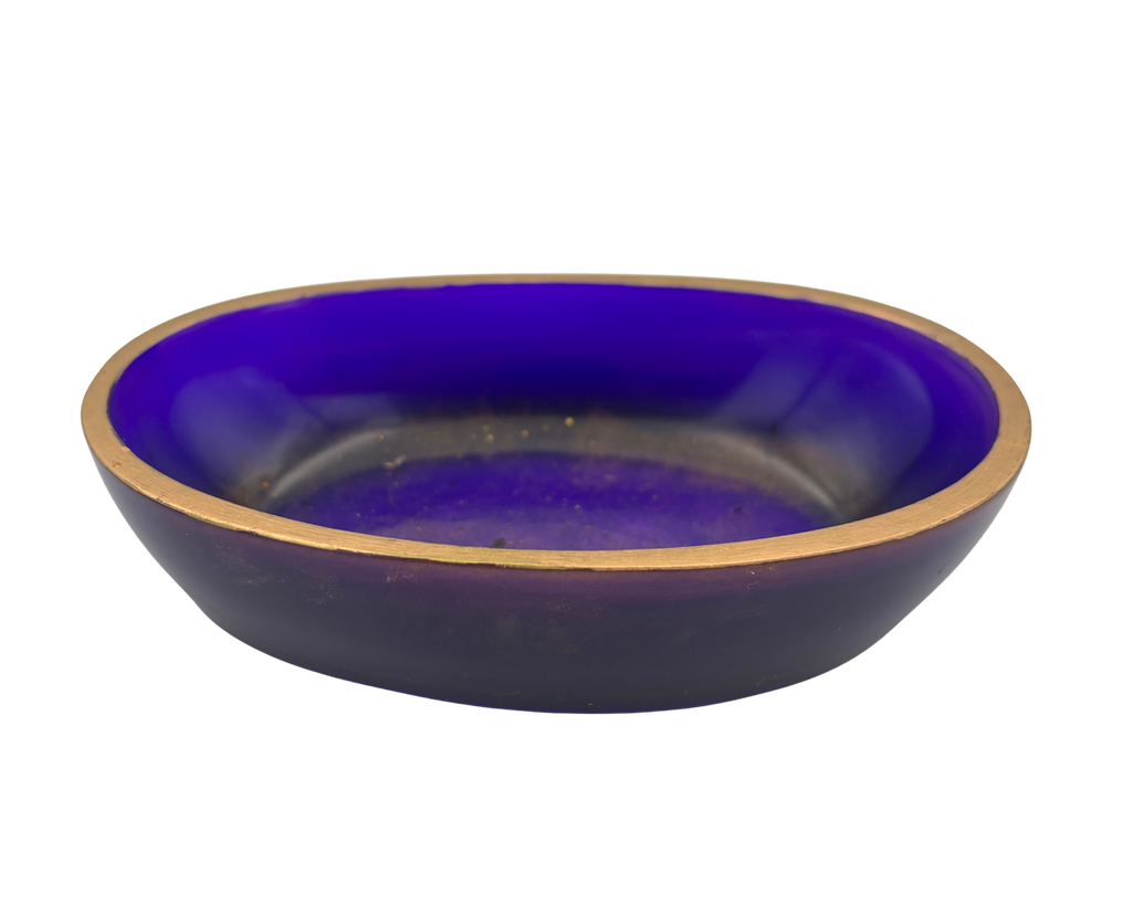 An oval resin dish with a deep purple and gold flecked interior and a metallic gold rim, shown against a plain white background.