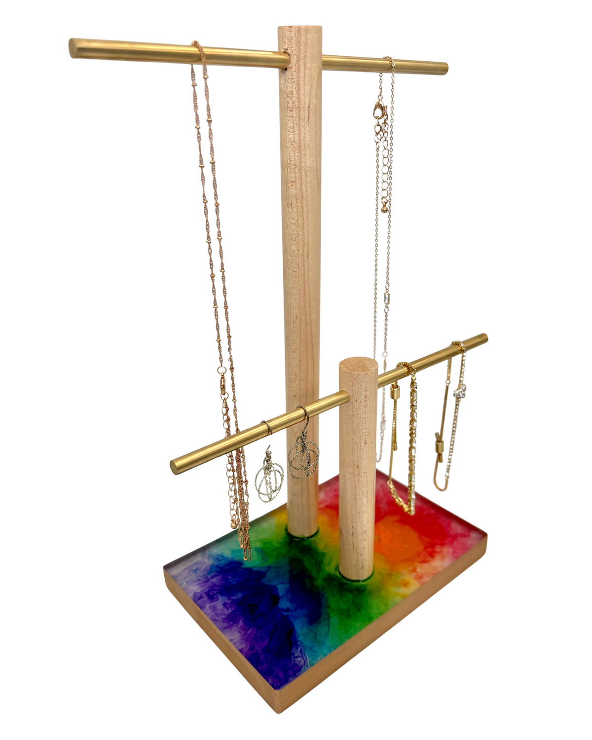 Jewelry stand with colorful base and hanging necklaces on a white background