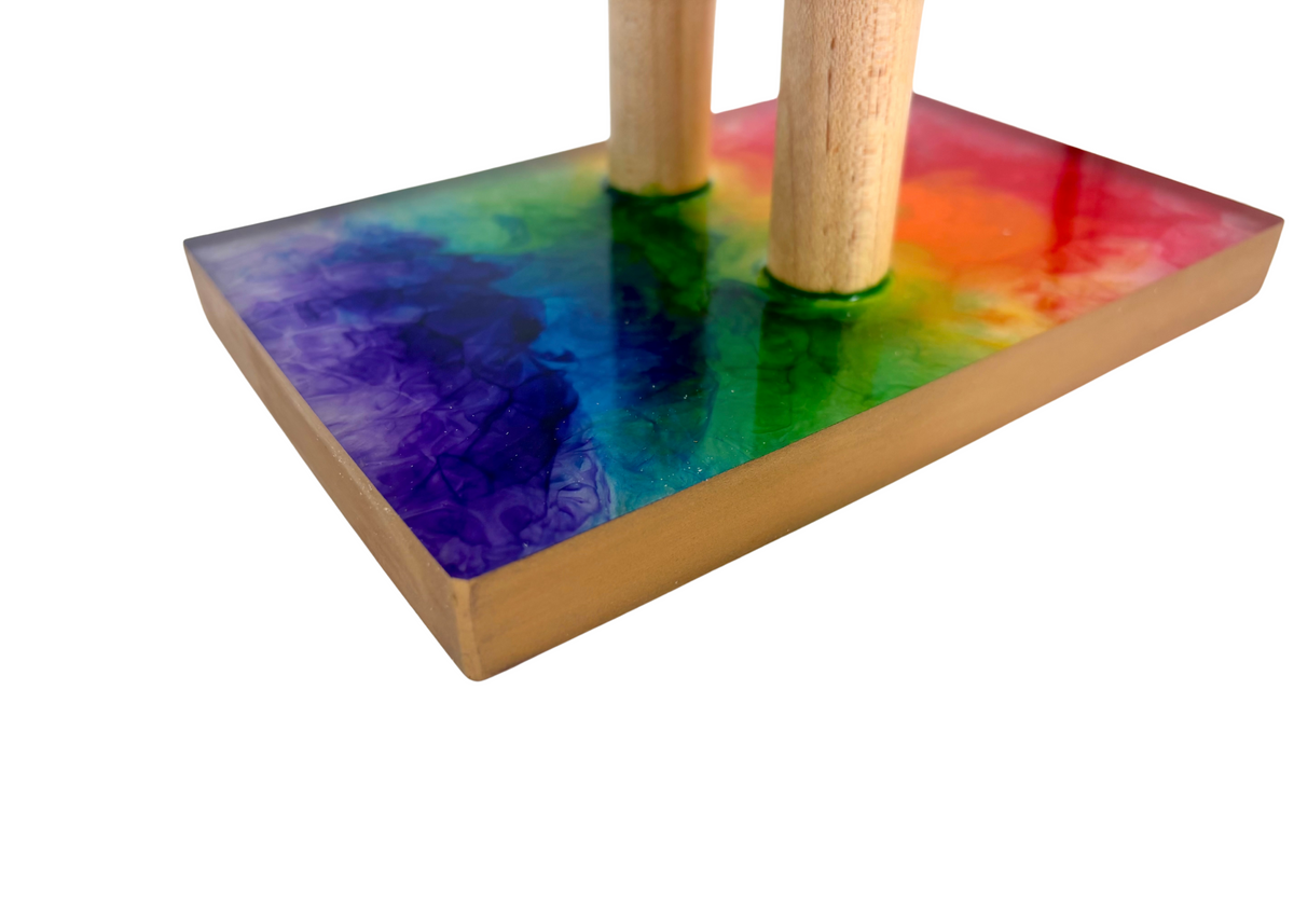 close up of colorful resin base with gold painted trim
