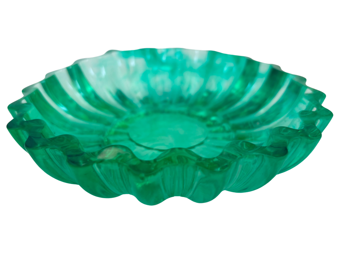 Green resin bowl with scalloped edges
