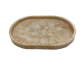 small oval Resin dish with beige and white marbled pattern on a white background