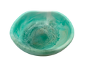 A small organic-shaped resin bowl with a swirled turquoise, teal, and mint green glaze, shown from a top-down perspective on a white background.