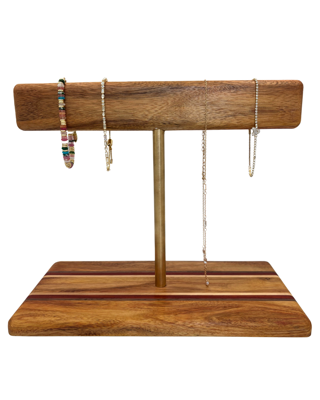 Wooden jewelry stand with a gold rod on a white background holding jewelry