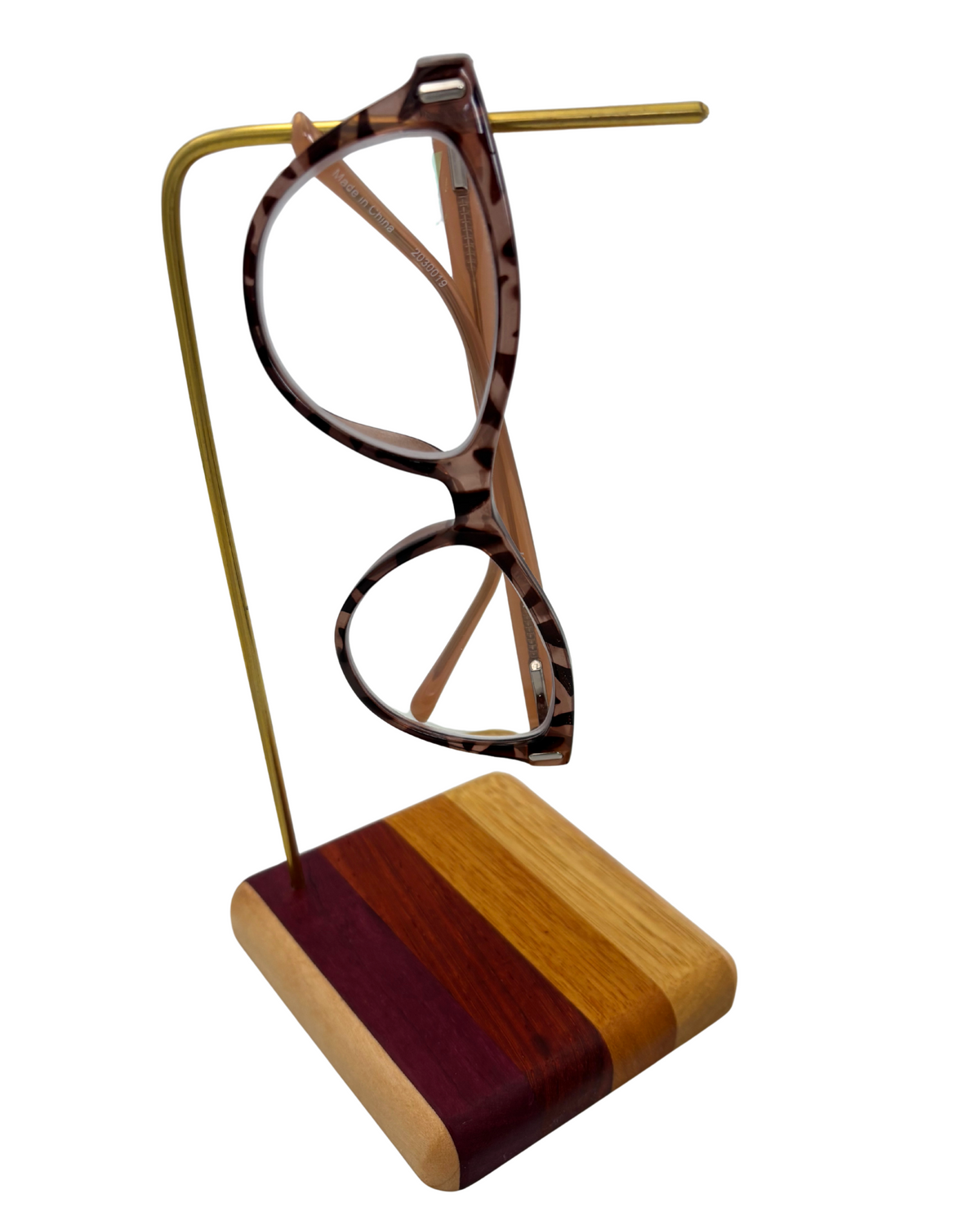 Glasses holder with wooden base and brass dowel holding pair of glasses