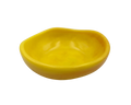 A small, organic-shaped yellow resin dish or shallow bowl, isolated on a solid white background.