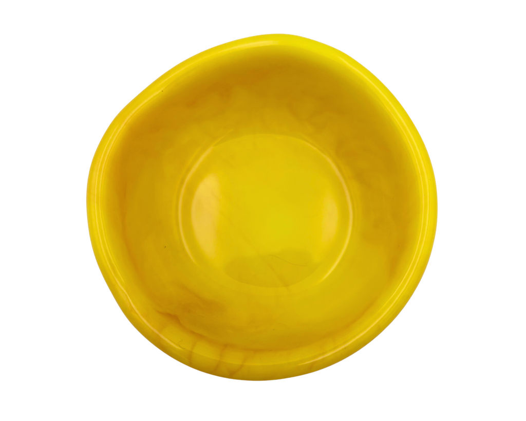 A small, shallow, asymmetrical yellow bowl with a smooth, glossy finish, isolated on a white background.